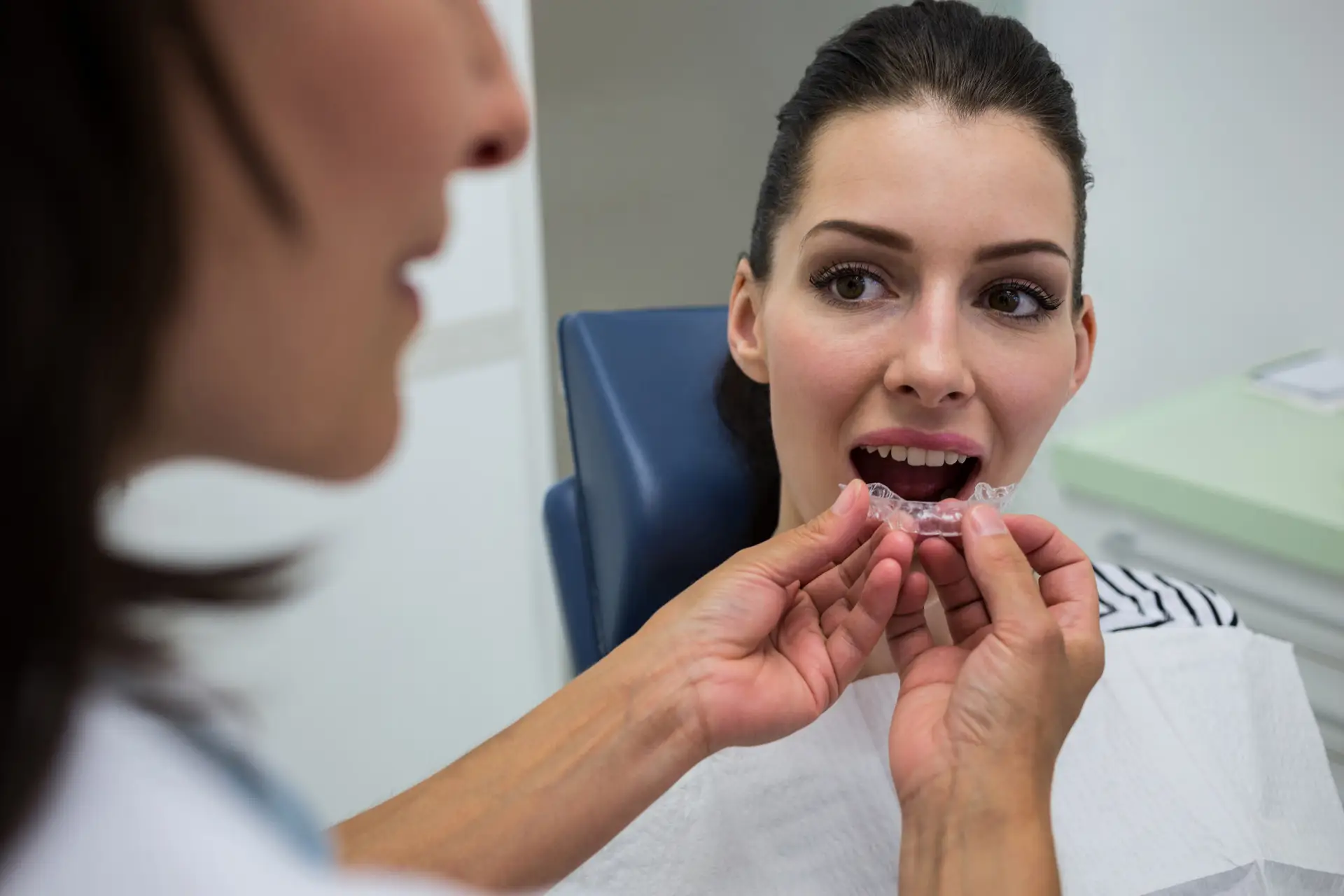 Patienttrying out their invisalign clear aligners treatment at Advanced Dental Solutions