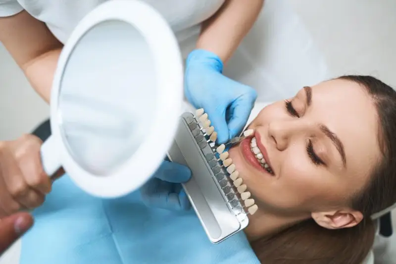 Patient browsing color options for dental veneers at Advanced Dental Solutions in Torrance CA